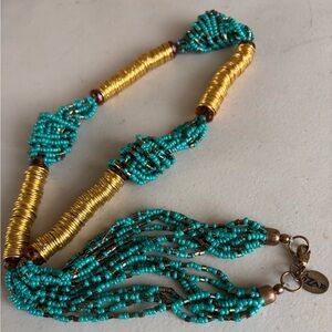 13” braided turquoise seed bead necklace with gold-toned metal accents.